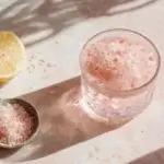 pink salt trick for weight loss drink in glass on table