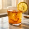 cayenne pepper water shot recipe with lemon and honey in a clear glass
