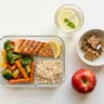 Healthy meal prep with grilled fish, roasted vegetables and rice representing Randy Jackson weight loss diet