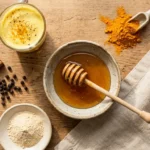 Neuro honey blend recipe ingredients including raw honey turmeric cinnamon black pepper and ashwagandha on wooden surface