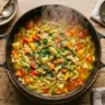 cabbage soup diet recipe in large pot with colorful vegetables and broth