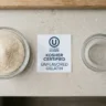 A bowl of unflavored gelatin powder on a kitchen counter