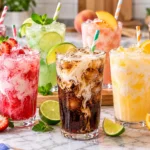 Assortment of homemade dirty soda recipes with cream fruit and ice