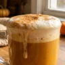 Homemade pumpkin latte with sweet cold foam and cinnamon sugar topping