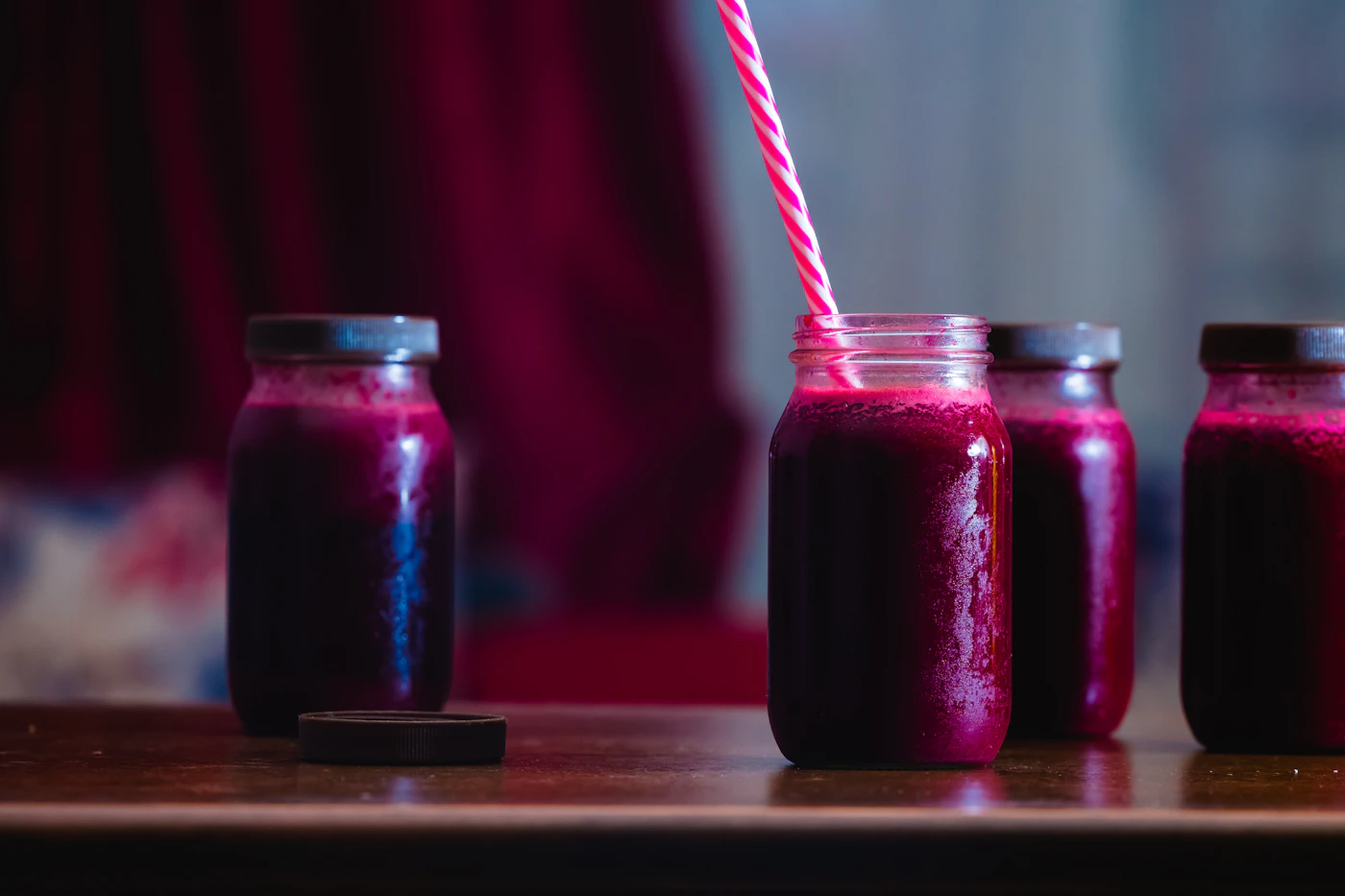 Fresh red beet juice served in glass jars