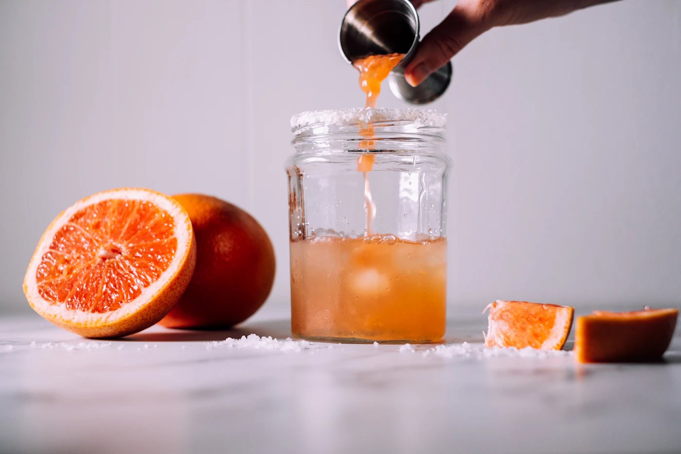 Pink grapefruit drink in a clear glass