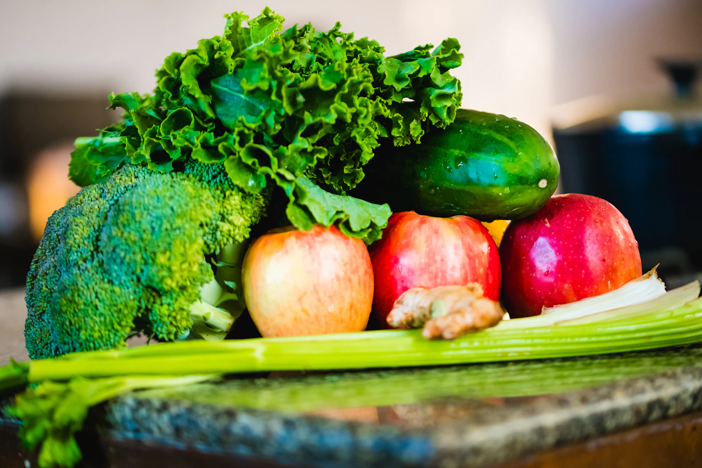 Fresh green juice being prepared with leafy vegetables