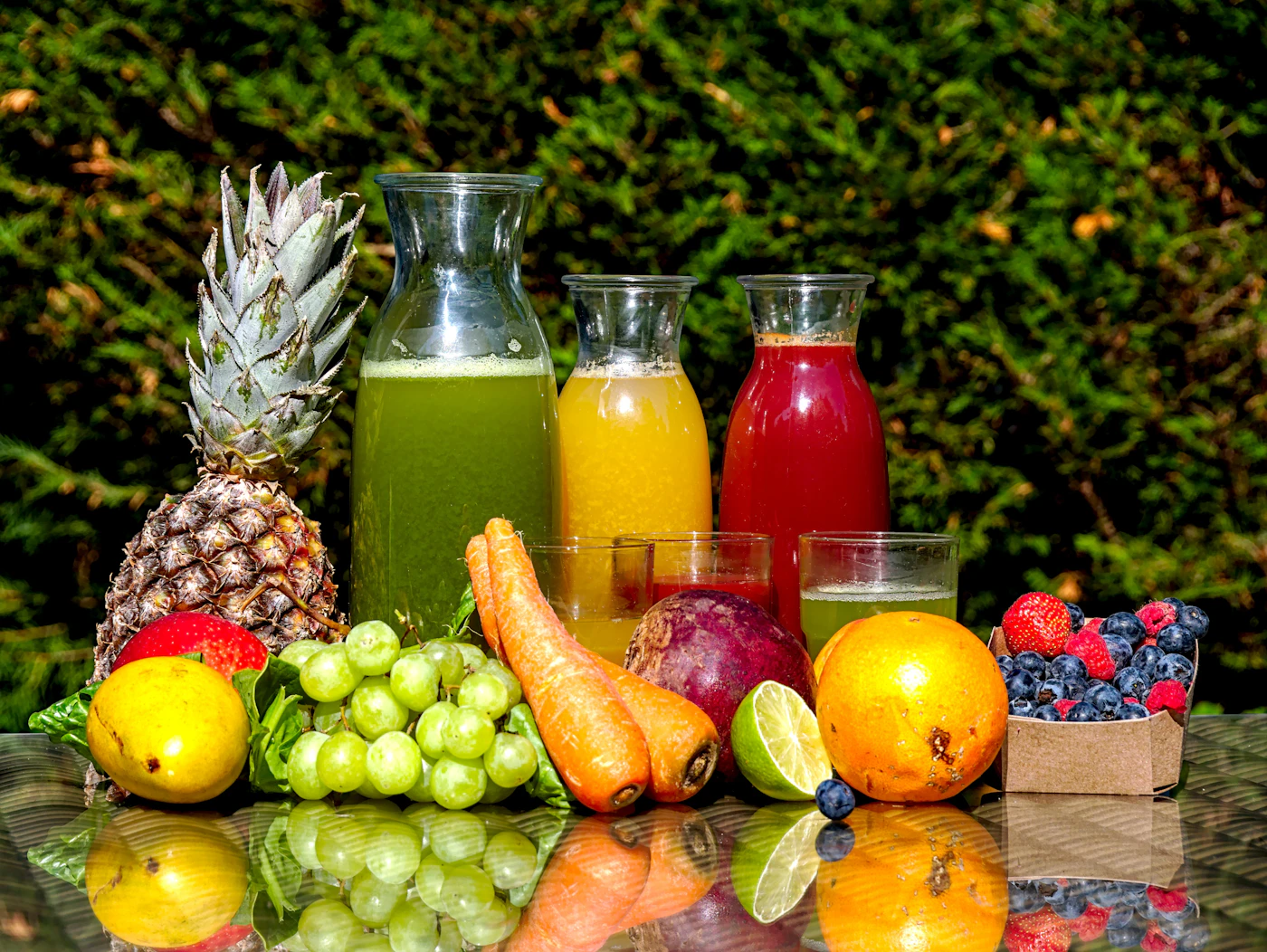 Fresh fruit and vegetable juices arranged on a table