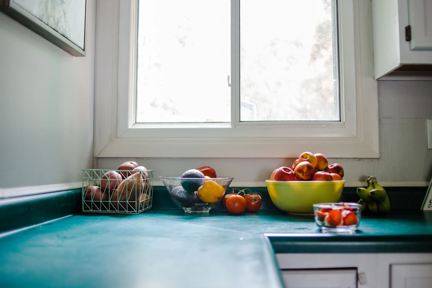 Fresh vegetable juice and produce arranged on a table