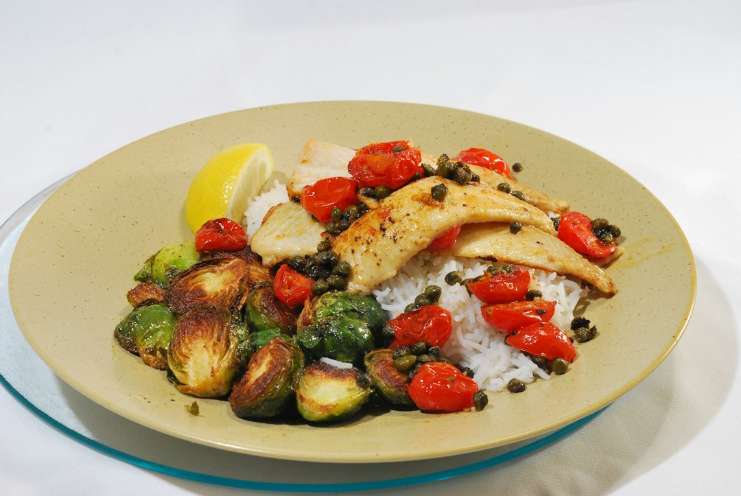 Mediterranean-style fish meal with vegetables for sardine recipe inspiration