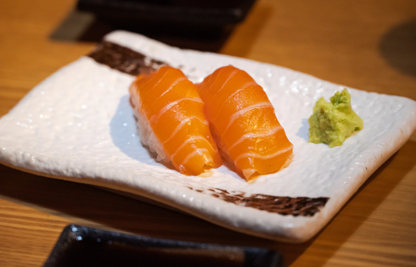 Salmon sashimi slices served without sushi rice